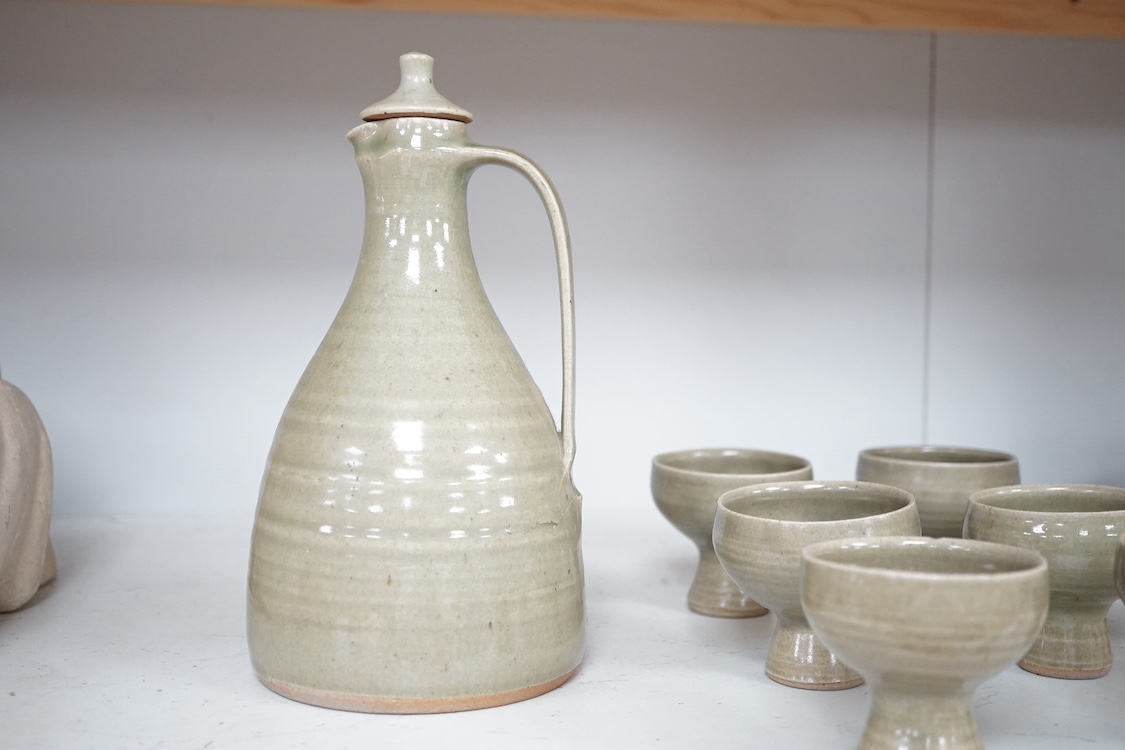 A David Leach St Ives pottery celadon glazed sake set comprising baluster lidded decanter and six stem cups, largest 23cm high. Condition - good